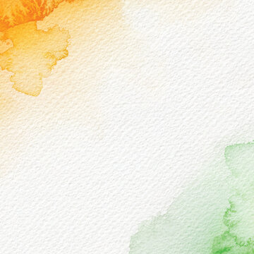 Watercolor paint splashing creating orange green abstract background