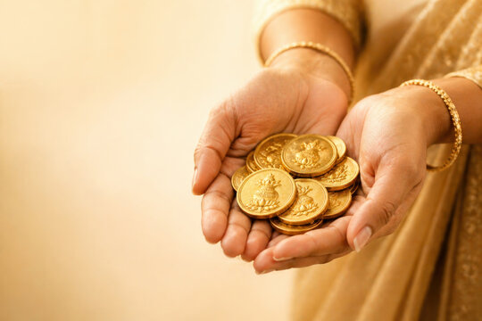 Akshaya Tritiya Festival with Hands Holding Golden Coins of Prosperity, Traditional Indian Celebration, Gold, Akha Teej Rituals