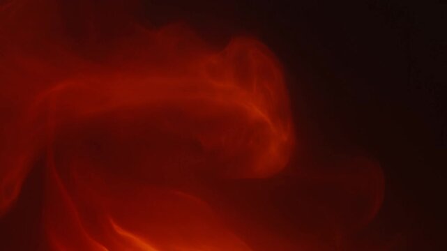 Abstract flames dancing in a dark background. Represents warmth, energy, and the elemental power of fire for various creative projects