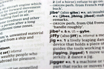 Fototapeta premium Close Up Of English Explanation Dictionary Page Word Of - jibe
