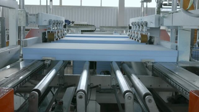 Industrial production line of extruded polystyrene foam boards in a factory