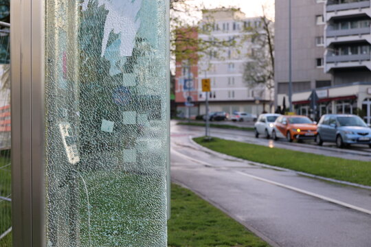 A glass pole with a lot of cracks and holes in it