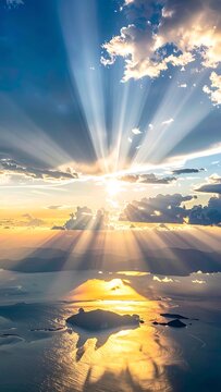 Sunrise over clouds with sun rays.