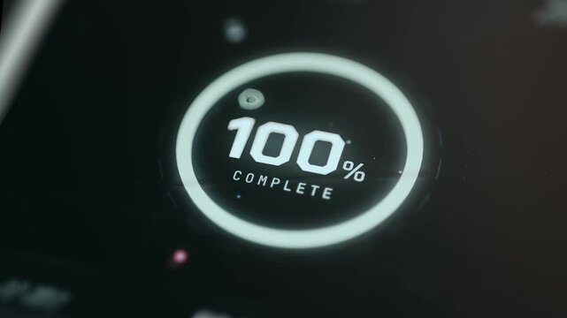 Digital display indicating a 100 percent completion status