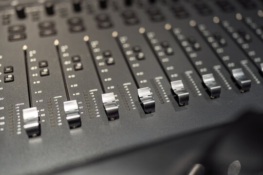 professional fader knobs of audio music production studio mixing equipment