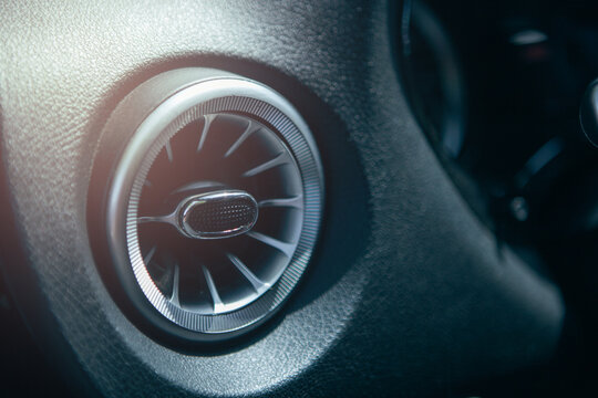 Close up of car air conditioner in modern car interior with selective focus