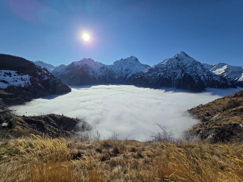 Roche de la Muzelle, Aiguille de V&eacute;nosc and T&ecirc;te de Lauranoure above cloud inversion, French Alps