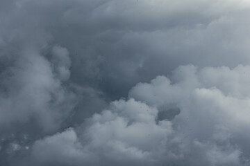 Dramatic gray clouds in the sky. Dark storm weather background. © senerdagasan