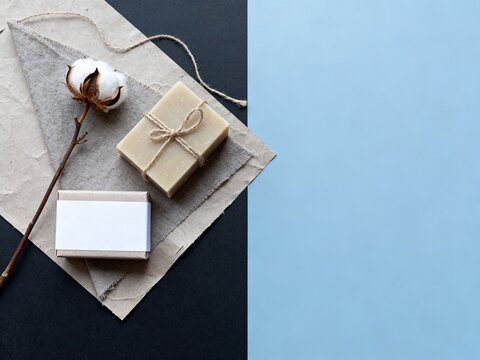 Natural Soap Bar with Cotton Flower on Textured Background