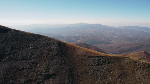 Aerial drone footage of a hiker climbing a steep mountain trail on the Continental Divide Trail, surrounded by rugged alpine terrain and expansive wilderness views.