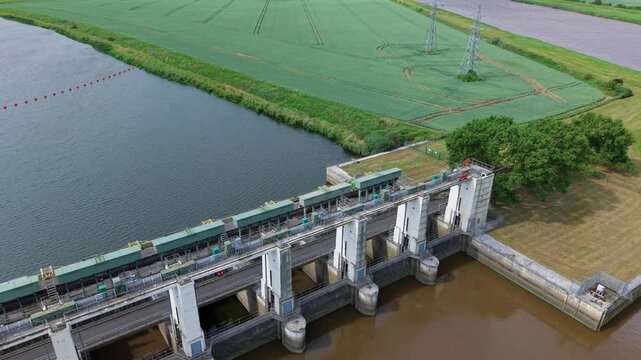 Wide aerial perspective of the Tail Sluice relief channel water management infrastructure in King's Lynn, Norfolk.