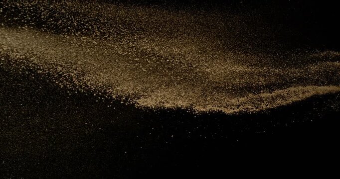 Super Slow Motion of Falling Brown powder, Dirt Soil in the Air. Filmed on High Speed Cinema Camera , 1000fps. Isolated on Black Background. Stripe Design.