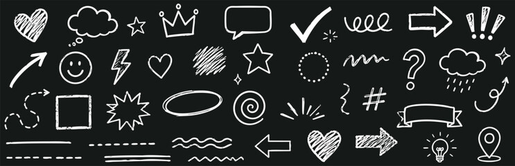 Hand drawn chalk doodle elements set on blackboard background collection of arrows, hearts, stars, speech bubbles, and various decorative shapes © Zbrake Studio