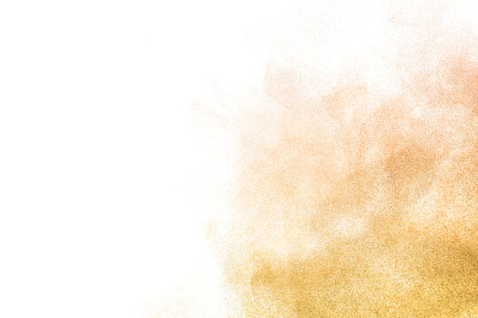 Abstract golden powder explosion isolated on white background with floating dust particles. Luxury glitter cloud, dynamic dispersion effect, elegant texture for premium design and branding.