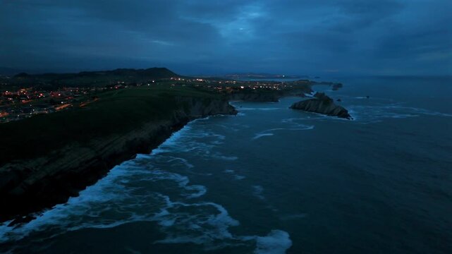 Aerial view of offshore sea stacks and dramatic Atlantic cliffs near Santander Spain
