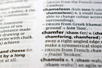 Fototapeta premium English Dictionary Page Close Up With The Word Definition Of - chamfer