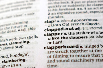 Fototapeta premium English Dictionary Page Close Up With The Word Transcription Of -clapped - out