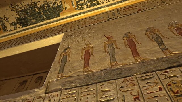 An interior view capturing a vibrant section of the painted stone murals inside the Tomb of Ramesses IV (KV2) in the Valley of the Kings, Luxor, Egypt.