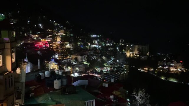 dazzling night view of shimla city illuminated with lights across hillside landscape