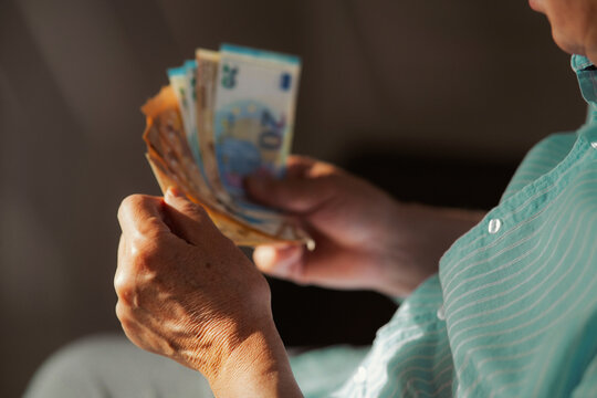 Hands holding euro banknotes indoors for saving and investment