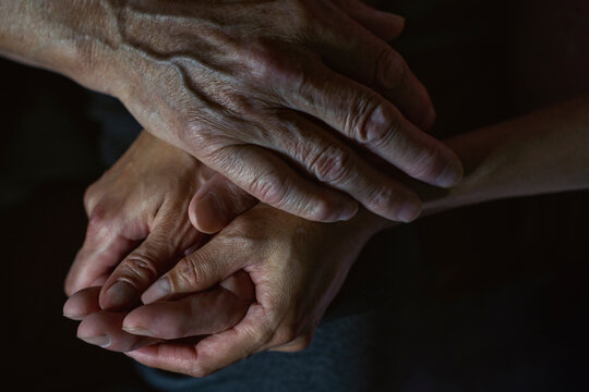 Holding hand to provide care and comfort during sickness
