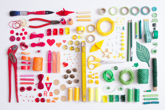 Tools, craft and painting materials on white ground