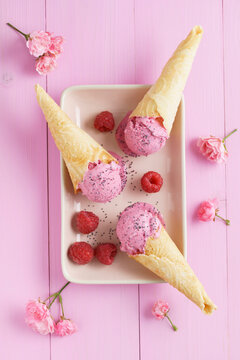 Raspberry icecream in homemade ice cream cones