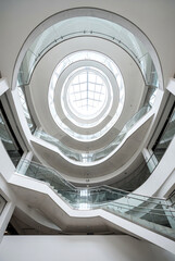 Fototapeta premium Modern Spiral Staircase in a Premium Business Building with Glass Railings and Bright Natural Light