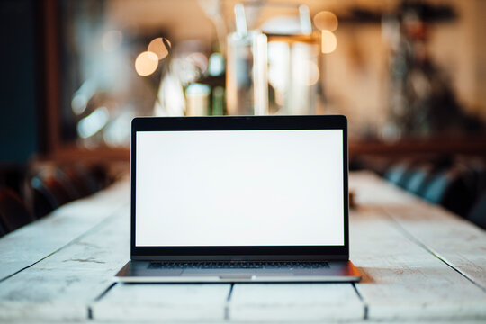 Laptop on table at cafe