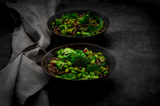 Healthy soba noodle bowl with broccoli edamame and pak choi