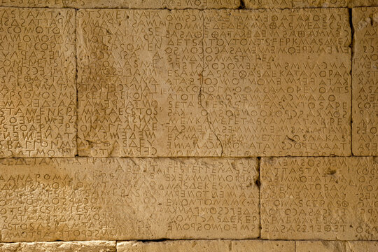 Alphabet carved on stonewall at Odeon Of Gortyn, Crete, Greece