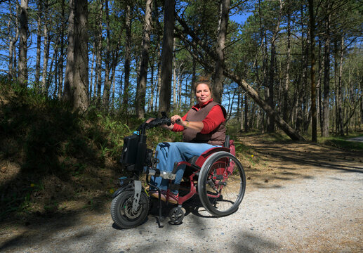 Wheelchair user with Ehlers Danlos syndrome on forest trail