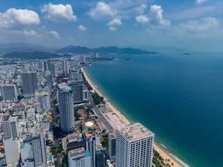 Fototapeten Tropischer Strand Aerial view Nha Trang Vietnam coastal skyline at with vibrant colors and urban beach scape  © Parilov