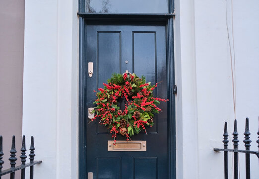 UK, England, London, Christmas wreath hanging on house entrance door