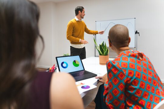 Businessman giving a presentation to colleagues in the office