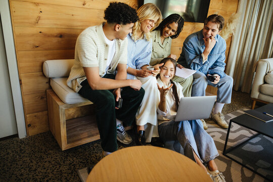 Gen Z business professionals brainstorming for startup in casual workspace