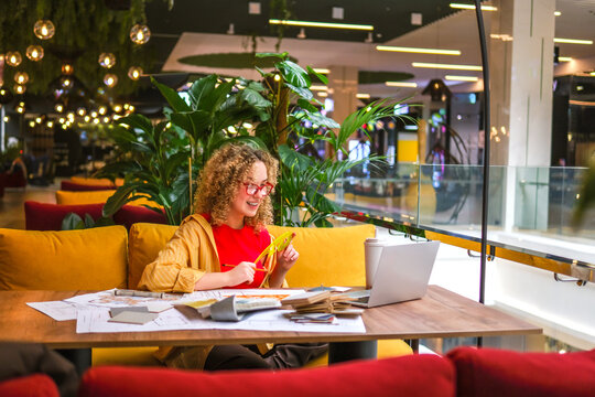 Architect with laptop in a biophilic workspace