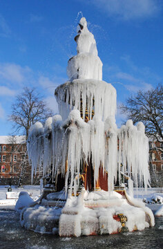 Ornate Victorian 19th Century Public Fountain  in Winter with Frozen Ice and Snow 