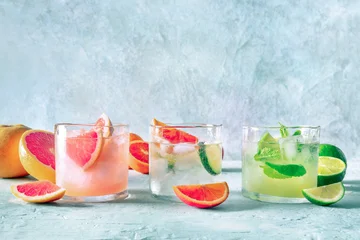 Refreshing summer cocktails with ice cubes on a light background © laplateresca