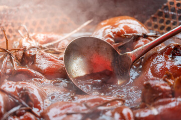 Fototapeta premium traditional braised soy sauce pork trotters steaming hot served in pot