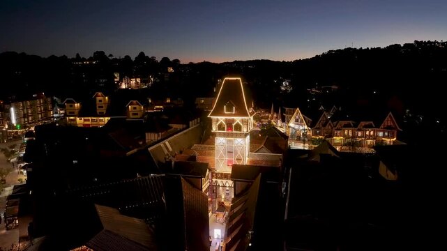 Night View Of Capivari Village In Campos Do Jordao In Sao Paulo Brazil. Illuminated Ferris Wheel. Downtown Cityscape. European Architecture. Capivari Village In Campos Do Jordao In Sao Paulo Brazil.