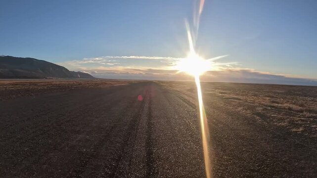 Thrilling 4K under-wing GoPro POV of a small airplane taking off from a rugged gravel runway. Flying over majestic glacial rivers and mountain landscapes in South Iceland.