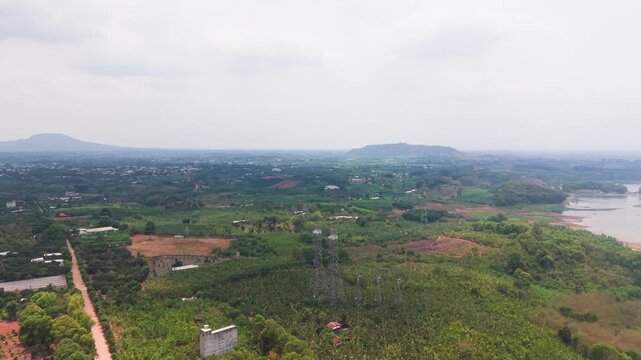 The landscape around Tri An Lake in Dong Nai, Vietnam. Views include the land, water, and some structures in the distance.