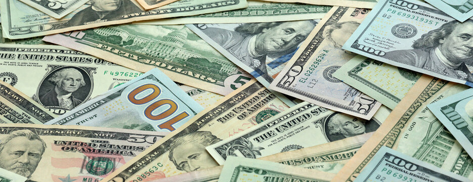 US dollar money banknotes pile on table. United States bills of USD currency. Concept of economy