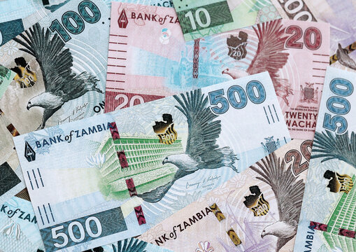Zambian kwacha money banknotes pile on table. Zambia bills of ZMW currency close up