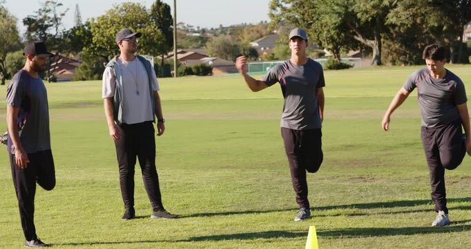 At whistle cue, coach, trainees switching quad and lateral bends for warm-up on field