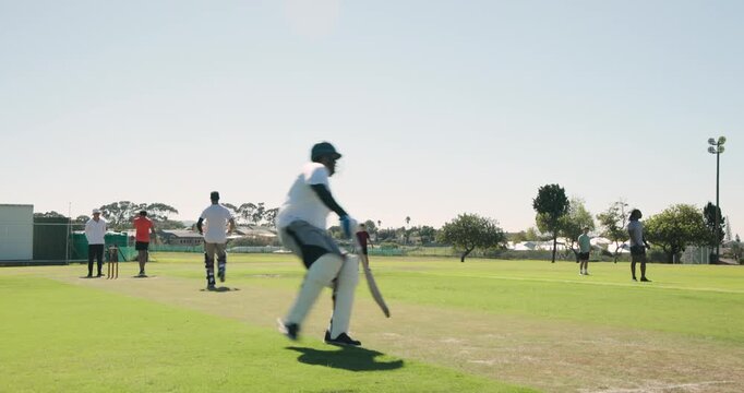 After driving red ball, batsman sprinting, diving to bat at crease on cricket pitch