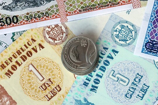 Moldovan leu money bills and coins in pile. Big amount of Moldova MDL currency cash close up