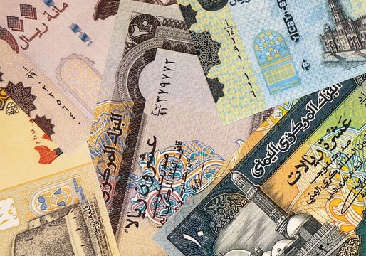 Yemeni rial money bills in pile on table. Yemen YER currency cash close up
