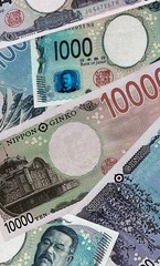 Japanese yen money bills in pile. Big amount of Japan JPY currency cash close up © Viktor